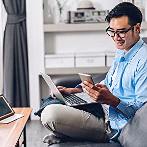 Man using phone laptop 
