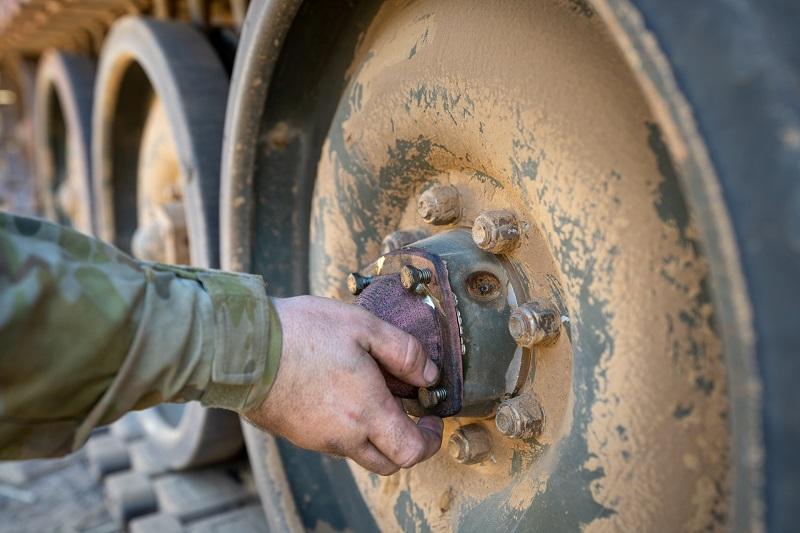 3D printed wheel bearing caps mounted on M113